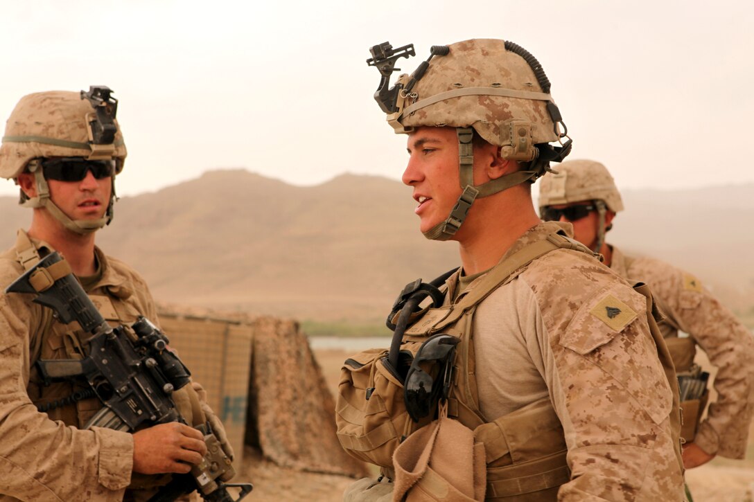 Darren McCarthy (left), a former U.S. Marine, greets Sgt. Scott J. Hambrick, a squad leader for Company C, 1st Battalion, 6th Marine Regiment. The 26th Marine Expeditionary Unit is providing support to the commemoration of the Battle of New Orleans. Starting through April and continuing through 2015, the Navy, Marine Corps, and Coast Guard will commemorate the Bicentennial of the War of 1812 and the Star Spangled Banner. The War of 1812 celebration will commemorate the rich Naval history and showcase the capabilities of today's Navy-Marine Corps team.  (Official Marine Corps photo by Lance Cpl. Scott L. Tomazycki)
