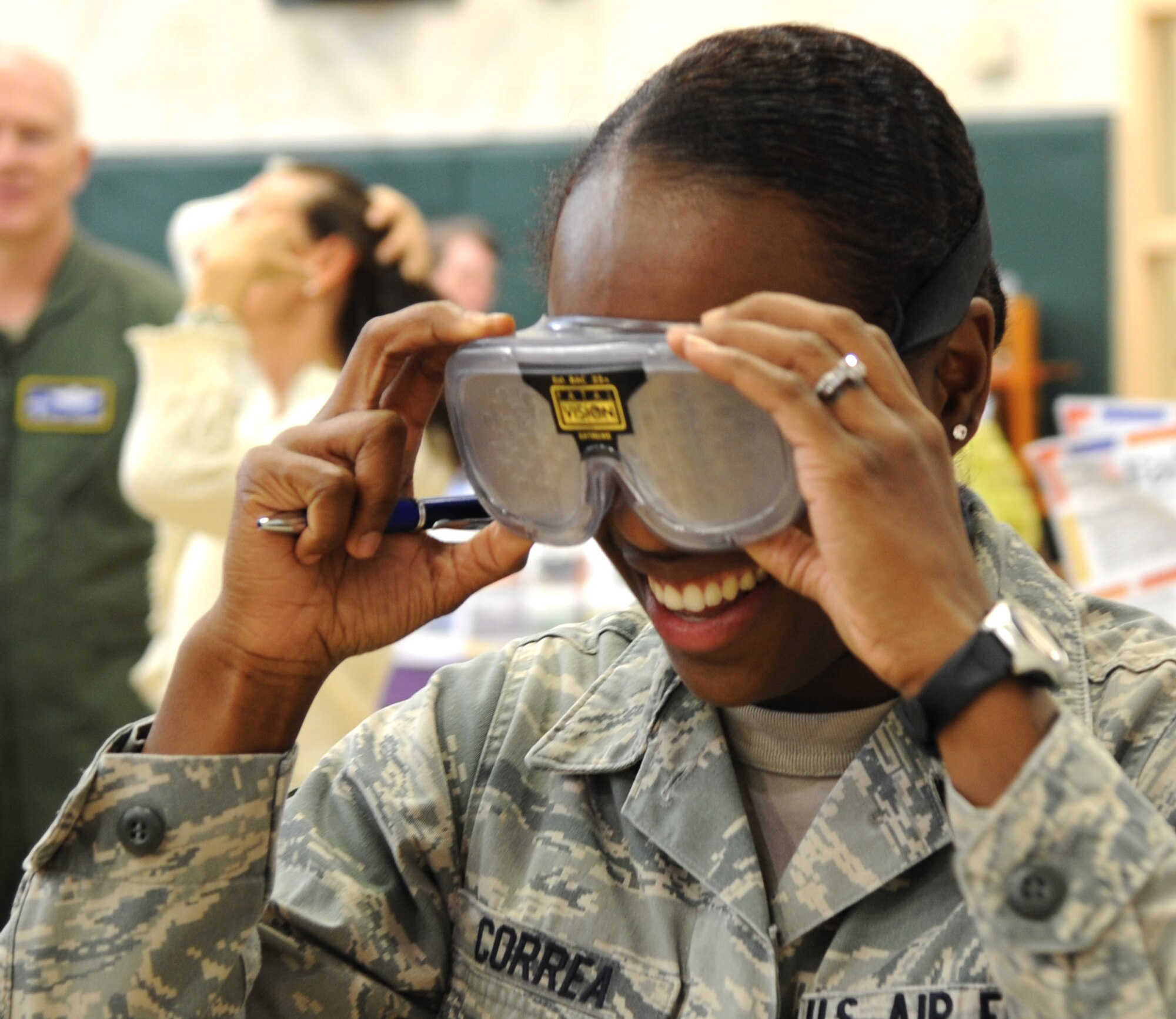 Senior Airman Laissha Correa, an executive assistant for the 71st Flying Training Wing command section, tries on “drunk goggles” during the Health and Wellness Fair held April 13 in the Youth Center gymnasium at Vance Air Force Base, Okla. The drunk goggles simulate how someone sees the world while inebriated. (U.S. Air Force photo/ Airman 1st Class Frank Casciotta)