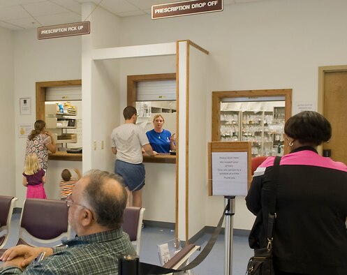 Team Barksdale members pick up prescriptions at the Satellite Pharmacy located in the Exchange on Barksdale Air Force Base, La., April 18. The Satellite Pharmacy will be closed April 20 for renovations. As a result, only the drive-through service will be available for pick-up of refilled prescriptions. All other pharmacy requests may be processed at the main clinic pharmacy. (U.S. Air Force photo/Senior Airman Kristin High)(RELEASED)