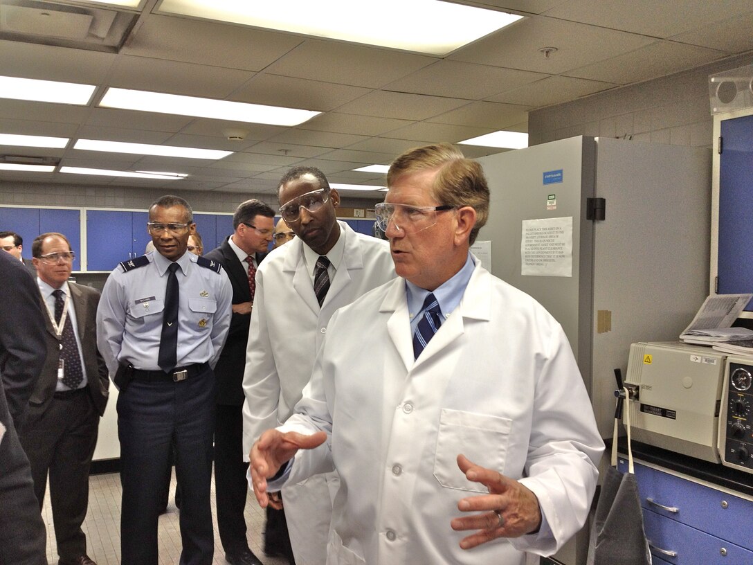 JOHNSTOWN, Penn. -- (From right) Terry Yonkers, Assistant Secretary of the Air Force for Installations, Environment and Logistics, and Timothy Bridges, Deputy Assistant Secretary of the Air Force for the Environment, Safety and Occupational Health, get a close up look at a new cutting-edge technology here April 4 that’s expected to reduce pollution and the exposure of Airmen to hazardous compounds. (U.S. Air Force photo/Lt. Col. David Pugh)