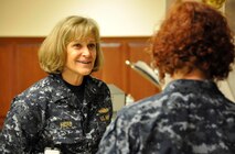 Navy Rear Adm. Martha Herb, Deputy, Navy Personnel Command Director Personal Readiness and Community Support, Washington, DC., listens as Petty Officer 2nd Class Jennifer Howell explains the mission of the uniform section at the Charles C. Carson Center for Mortuary Affairs April 9, 2012. Howell, a Navy mortician is assigned to the Navy and Marine Corps Liaison office. Herb toured the mortuary and the Center for Families of the Fallen. (U.S. Air Force photo/Tech. Sgt. Myco Apat)