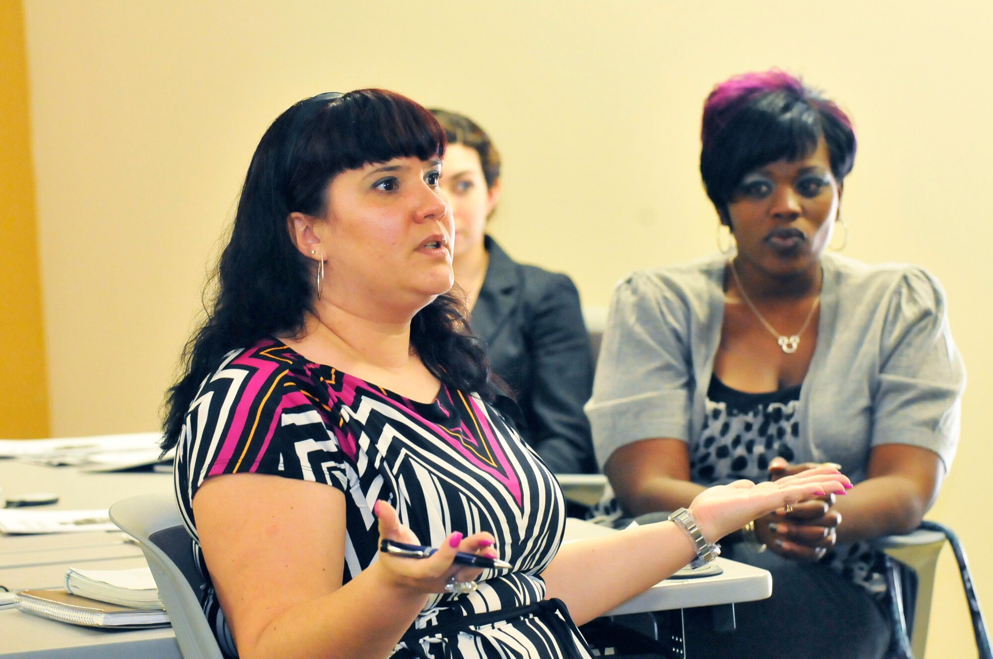 Erin Cunningham, wife of Staff Sgt. Mikael Cunningham, talks about living in different locations and cultures at the Customer Service/Personal Skills class at Middle Georgia Technical College. The training is offered to help active-duty Air Force spouses meet the challenges of the military lifestyle by providing employment skills training and job marketability. (U. S. Air Force photo by Sue Sapp)