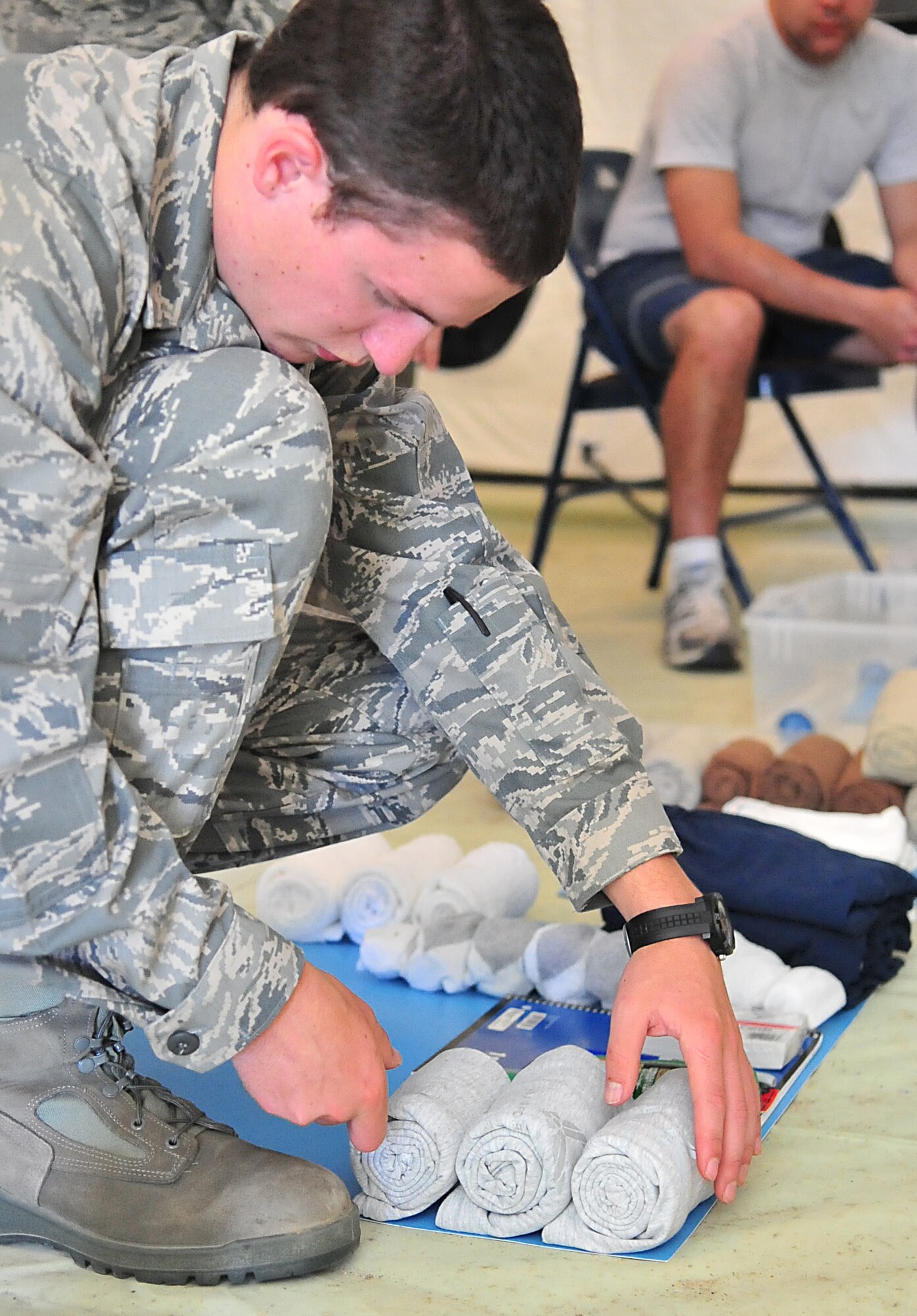 An Air Force ROTC cadet arranges his personal belongings for an inspection on Seymour Johnson Air Force Base, N.C., April 14, 2012. Cadets from seven colleges throughout N.C. gathered here for a field training preparation exercise where they participated in activities to enhance their military knowledge and develop leadership skills. (U.S. Air Force photo/Staff Sgt. Makenzie Lang/Released)