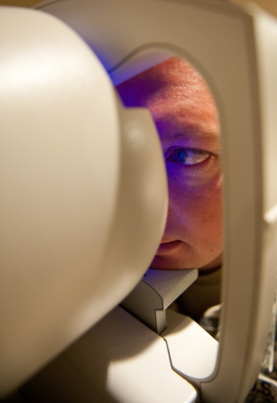 U.S. Army Staff Sgt. David Neugebauer, 235th Military Police Company training NCO, receives a corneal topography during a routine eye exam in the 28th Medical Operations Squadron Optometry Clinic at Ellsworth Air Force Base, S.D., April 12, 2012. The optometry clinic is responsible for administering eye exams, issuing corrective lenses, acting as a liaison for optical surgeries, and similar optical services to servicemembers assigned to Ellsworth and their families. (U.S. Air Force photo by Airman 1st Class Kate Thornton/Released)