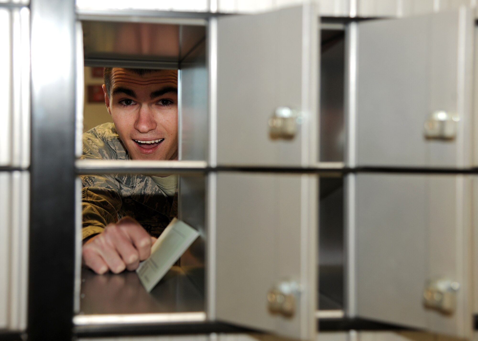 Airman 1st Class Jay Traver, 319th Communications Squadron, places a letter
in a mailbox at the Base Postal Office on April 3, 2012, on Grand Forks Air
Force Base, N.D.  (U.S. Air Force photo/Airman 1st Class Ashley N. Taylor)
