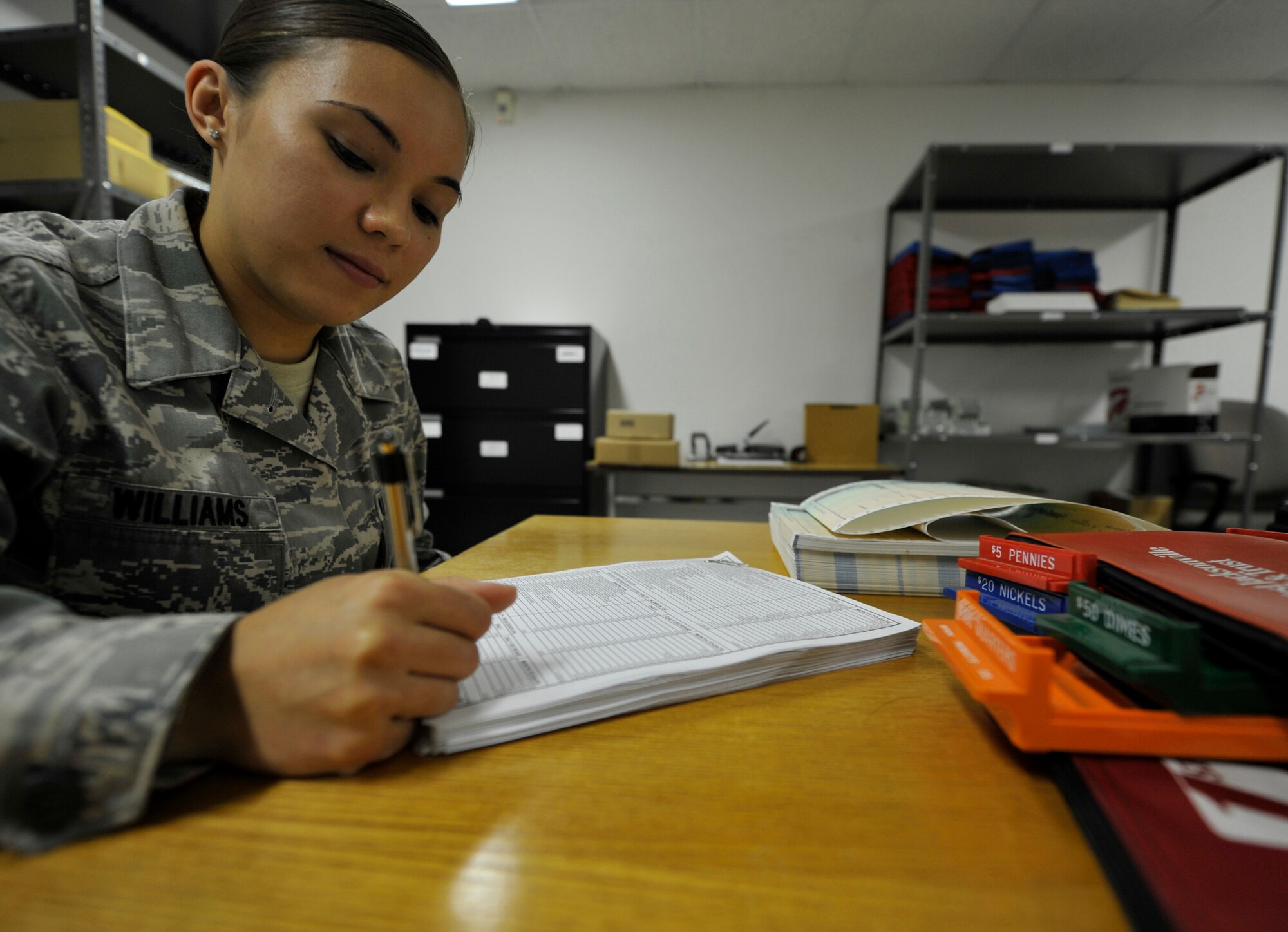 Airman 1st Class Keren Williams, a 19th Comptroller Squadron financial analyst, analyzes budget information, at Little Rock Air Force Base, Ark. Williams, a Duluth, Minn., native, is responsible for providing expert financial analysis on the 19th Medical Group's $9.6 million budget. (U.S. Air Force photo by Senior Airman Caleb Pierce)