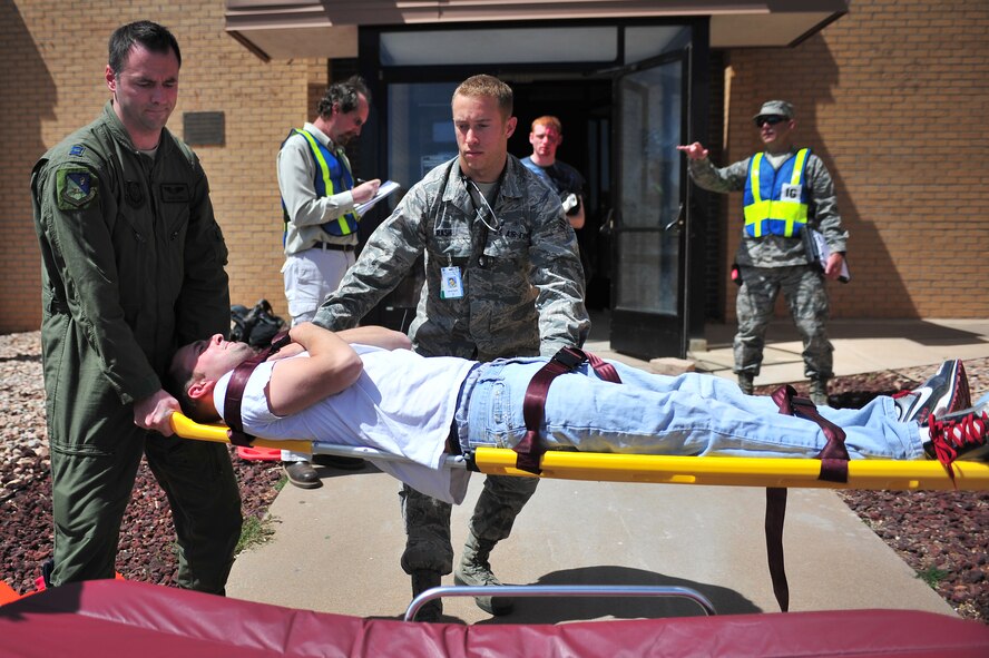 Cannon Air Commandos prepare to relocate a simulated tornado victim during a natural disaster exercise at Cannon Air Force Base, N.M., April 5, 2012. Training exercises provide a safe and controlled environment to practice tactics, techniques and procedures. (U.S. Air Force photo by Airman 1st Class Alexxis Pons Abascal)