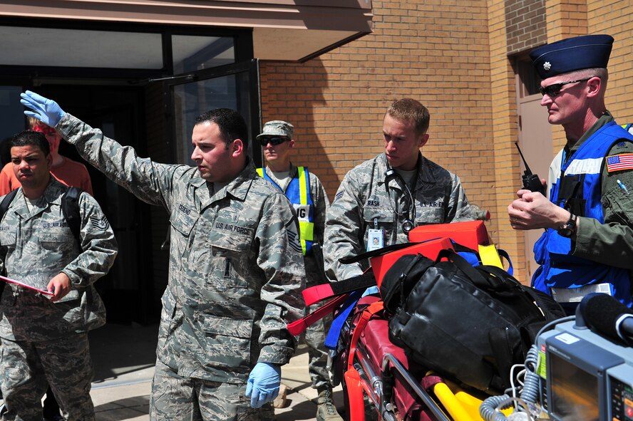 First responders prepare to relocate simulated tornado victims during a natural disaster exercise at Cannon Air Force Base, N.M., April 5, 2012. Training exercises provide a safe and controlled environment to practice tactics, techniques and procedures. (U.S. Air Force photo by Tech. Sgt. Josef Cole)