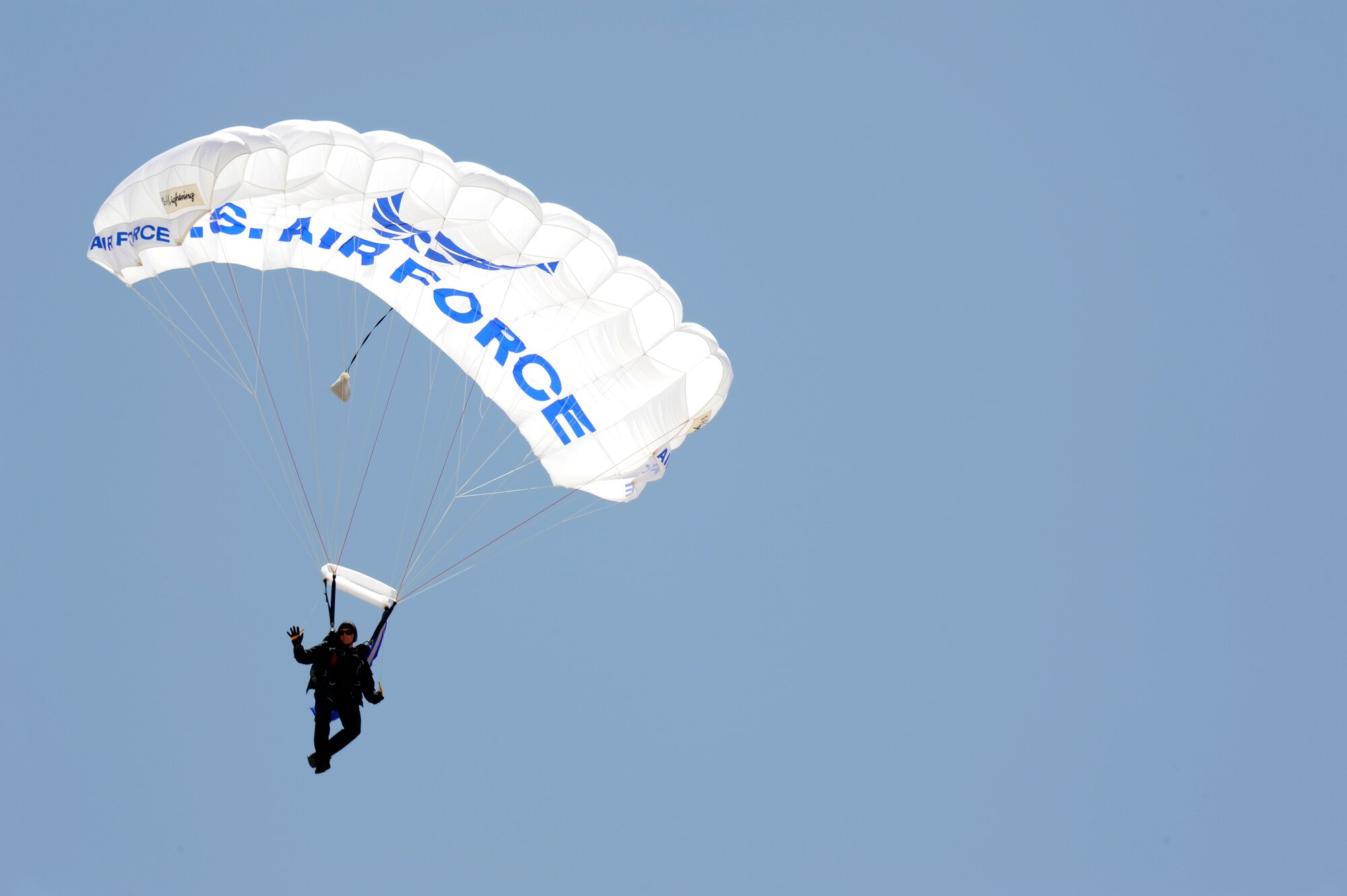 Members of the Wings of Blue parachute team provide an aerial demonstration during the 2012 open house at Davis-Monthan Air Force Base, Ariz., April 15, 2012. The team travels locally, nationally and internationally to perform in varied air shows. (U.S. Air Force photo by Tech. Sgt. Christopher Campbell/Released)