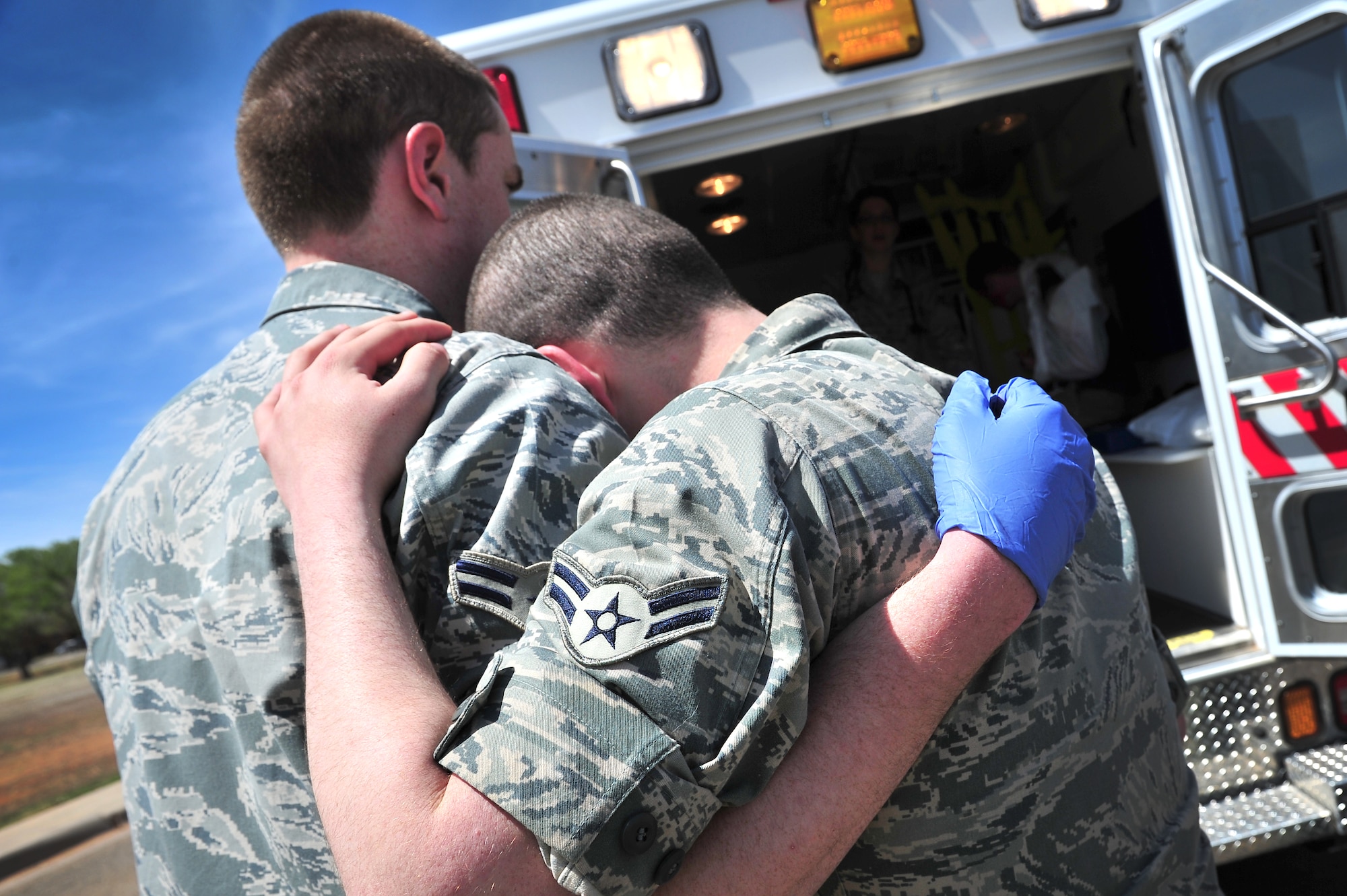Simulated tornado victims console each other during a natural disaster exercise at Cannon Air Force Base, N.M., April 5, 2012. Training exercises provide a safe and controlled environment to practice tactics, techniques and procedures. (U.S. Air Force photo by Tech. Sgt. Josef Cole)