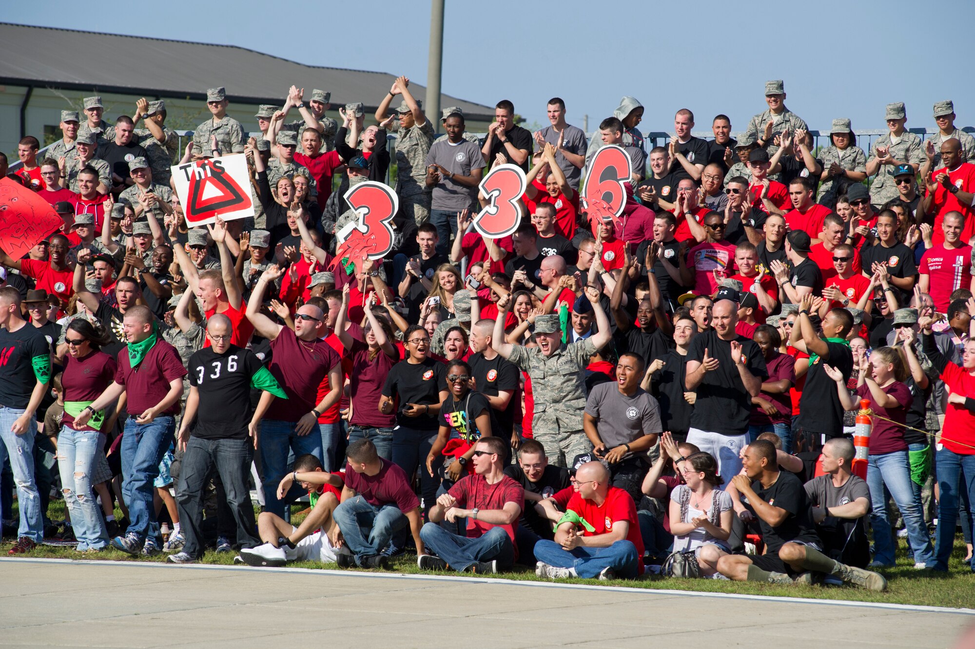 Students and supporters of the 336th Training Squadron Red Wolves burst in to cheers at the announcement of their overall victory at the drill down competition April 13, 2012, at Keesler Air Force Base, Miss., behind the Levitow Training Support Facility. The 336th TRS won second place in drill down regulation, first in open ranks and first overall. Friday’s competition was the first quarterly drill down of the season but Brig. Gen. Andrew Mueller’s last as the 81st Training Wing commander.  (U.S. Air Force photo by Adam Bond)