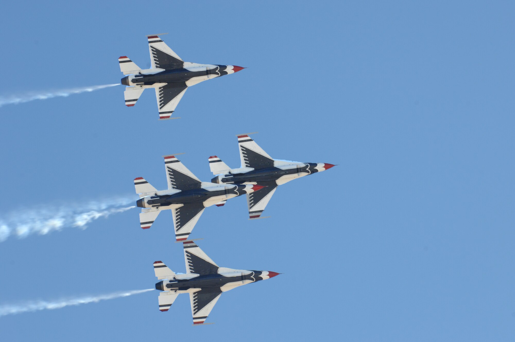 U.S. Air Force Thunderbirds demonstration team, flies in  a diamond formation at the open house on Davis-Monthan Air Force base, Ariz., April 15, 2012. During the 2012 season, the team will spend more than 200 days on the road. (U.S. Air Force photo by Airman 1st Class Josh Slavin/Released) 