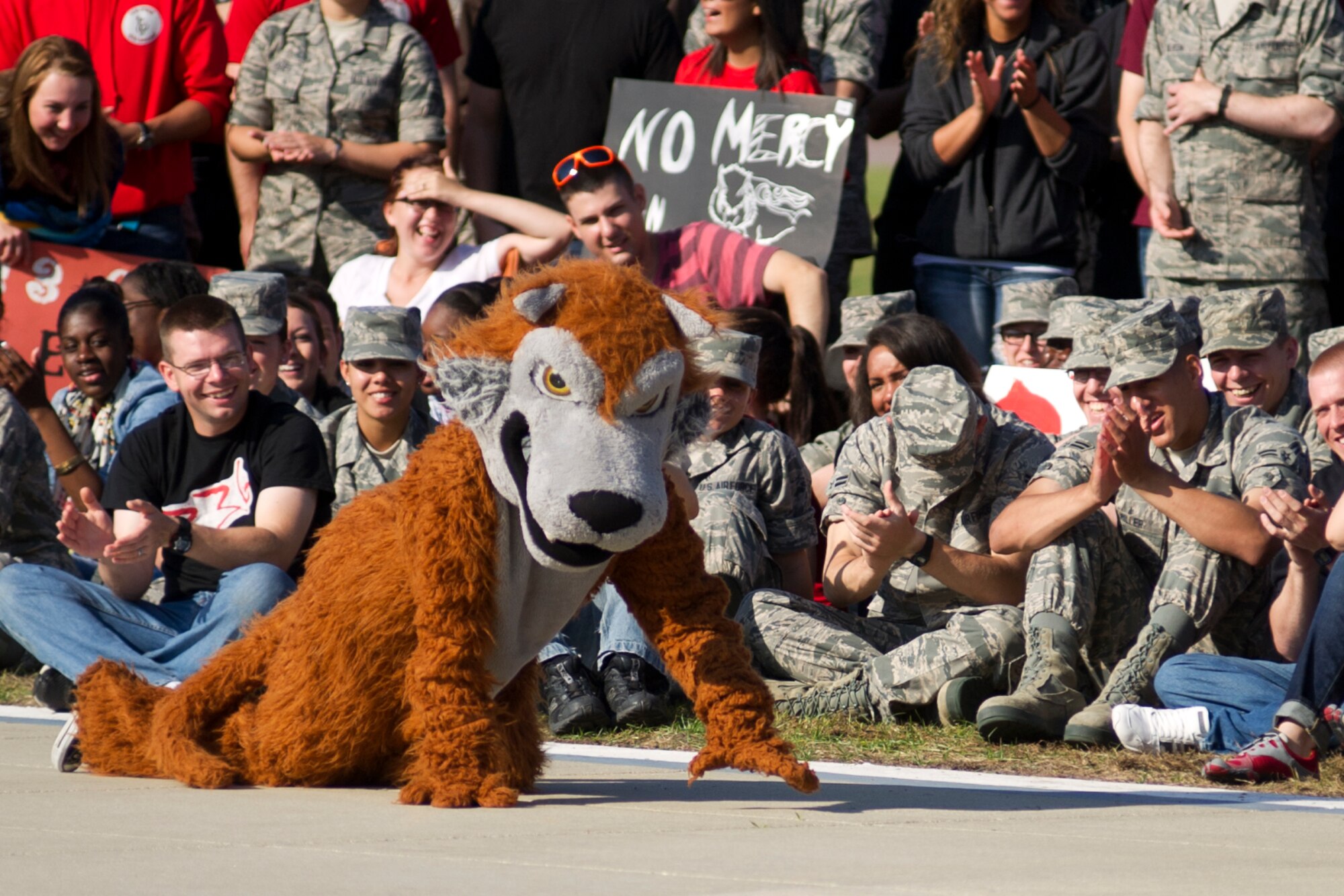 The 336th Training Squadron mascot gets stealthy during the drill down competition April 13, 2012, at Keesler Air Force Base, Miss. The Red Wolves won the competition which included an open ranks inspection, regulation drill and freestyle drill categories.  (U.S. Air Force photo by Adam Bond)
