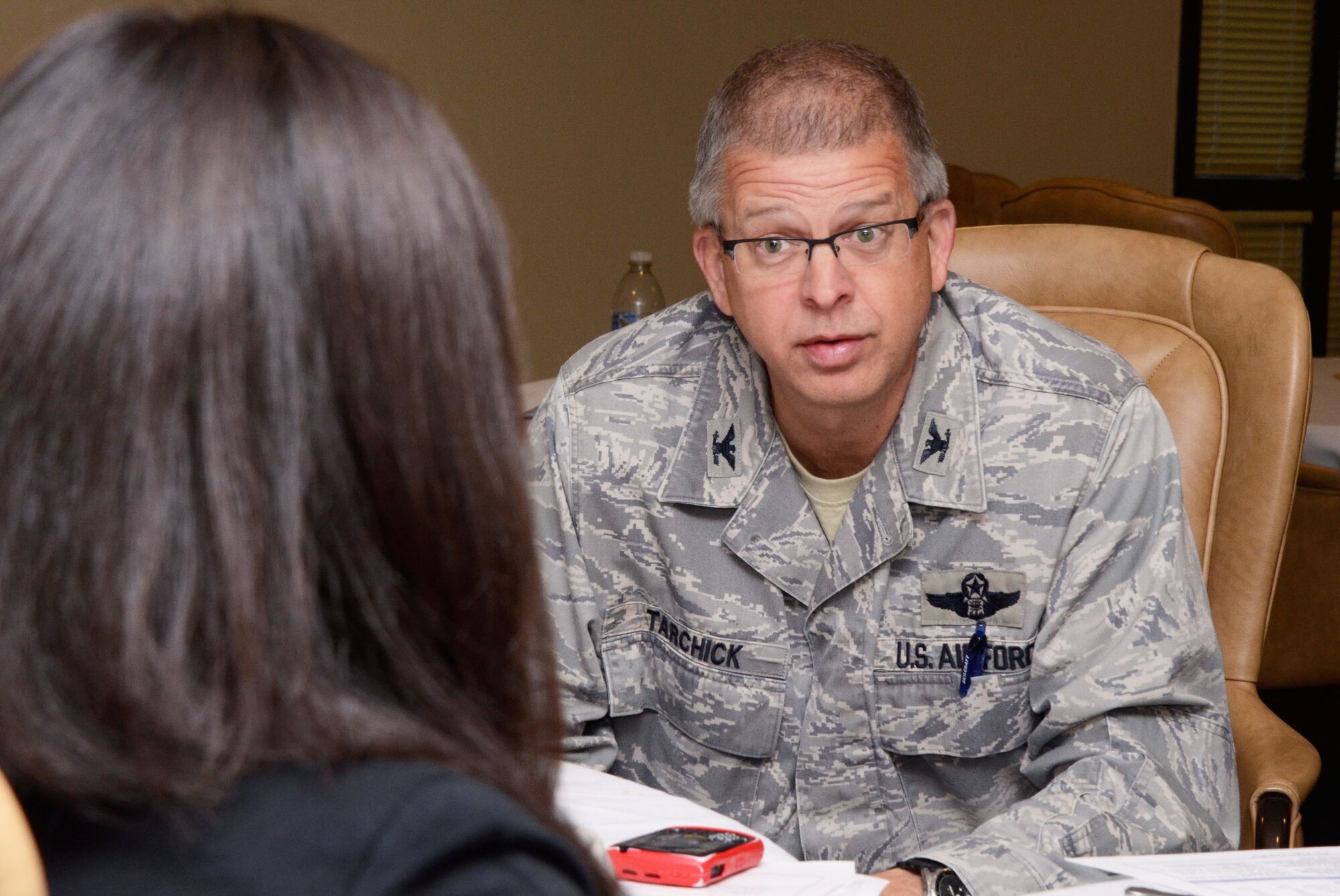 Col.Tim Tarchick, 94th Airlift Wing commander discusses issues relating to Dobbins reserve members with congressional staffers at a breakfast held here April 12. (U.S. Air Force photo/Don Peek)