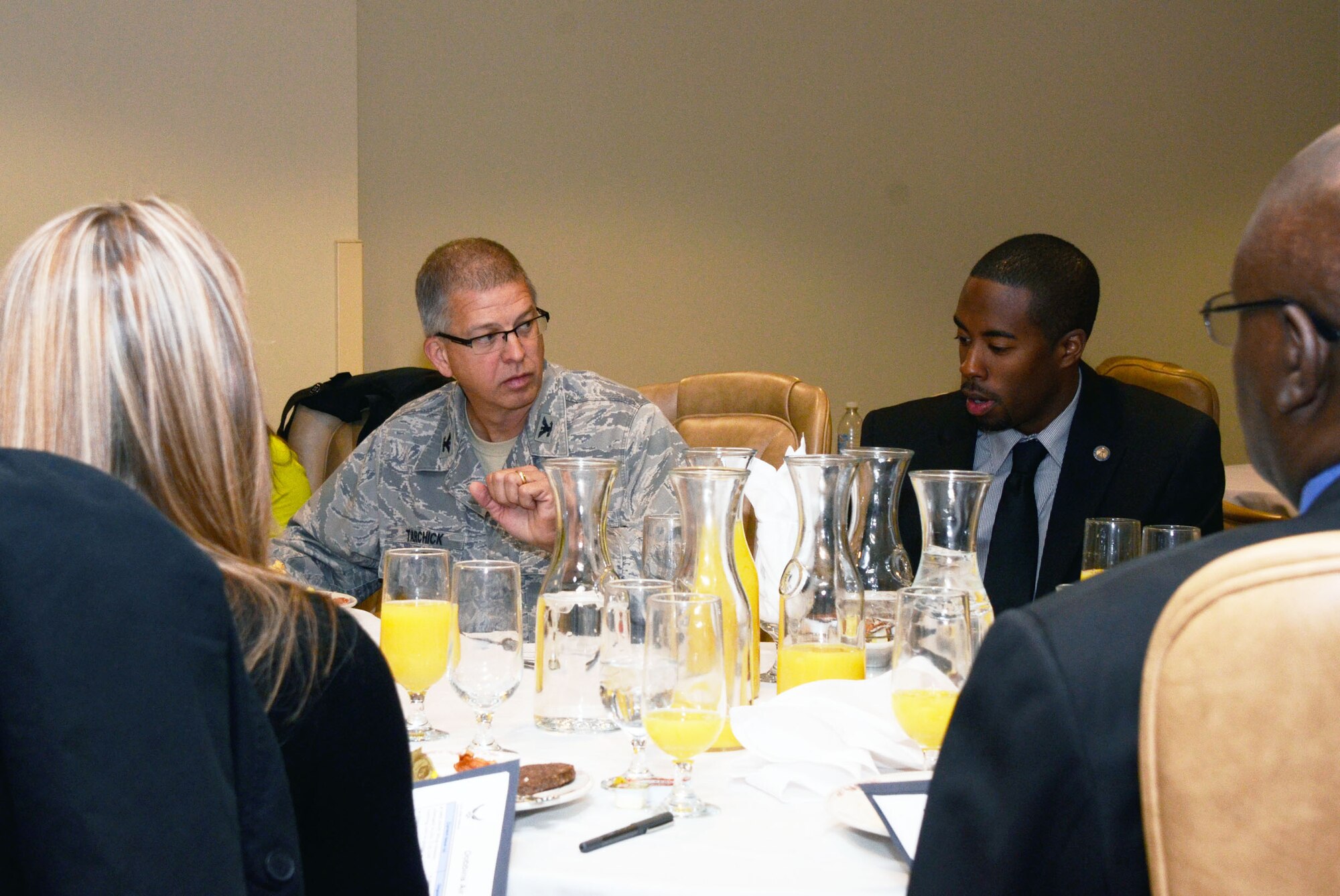 Rami "Ray" Khalfani, staff member for Congressman Hank Johnson discusses issues relating to Dobbins reserve members with Col. Timothy E. Tarchick, 94th Airlift Wing commander at a Congressional Staffers Breakfast held here April 12. (U.S. Air Force photo/Don Peek)