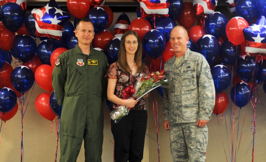 U.S. Air Force Col. Billy Thompson, 23d Wing commander, and Chief Master Sgt. Frank Batten, 23d WG command chief, present the Angel Award to Kendra Priddy during the 2012 Annual Volunteer Recognition Ceremony at Moody Air Force Base, Ga., April 17, 2012. Priddy served as the volunteer income tax assistance site coordinator and supervised more than 20 tax preparers from the wing. (U.S. Air Force photo by Airman 1st Class Douglas Ellis/Released)
