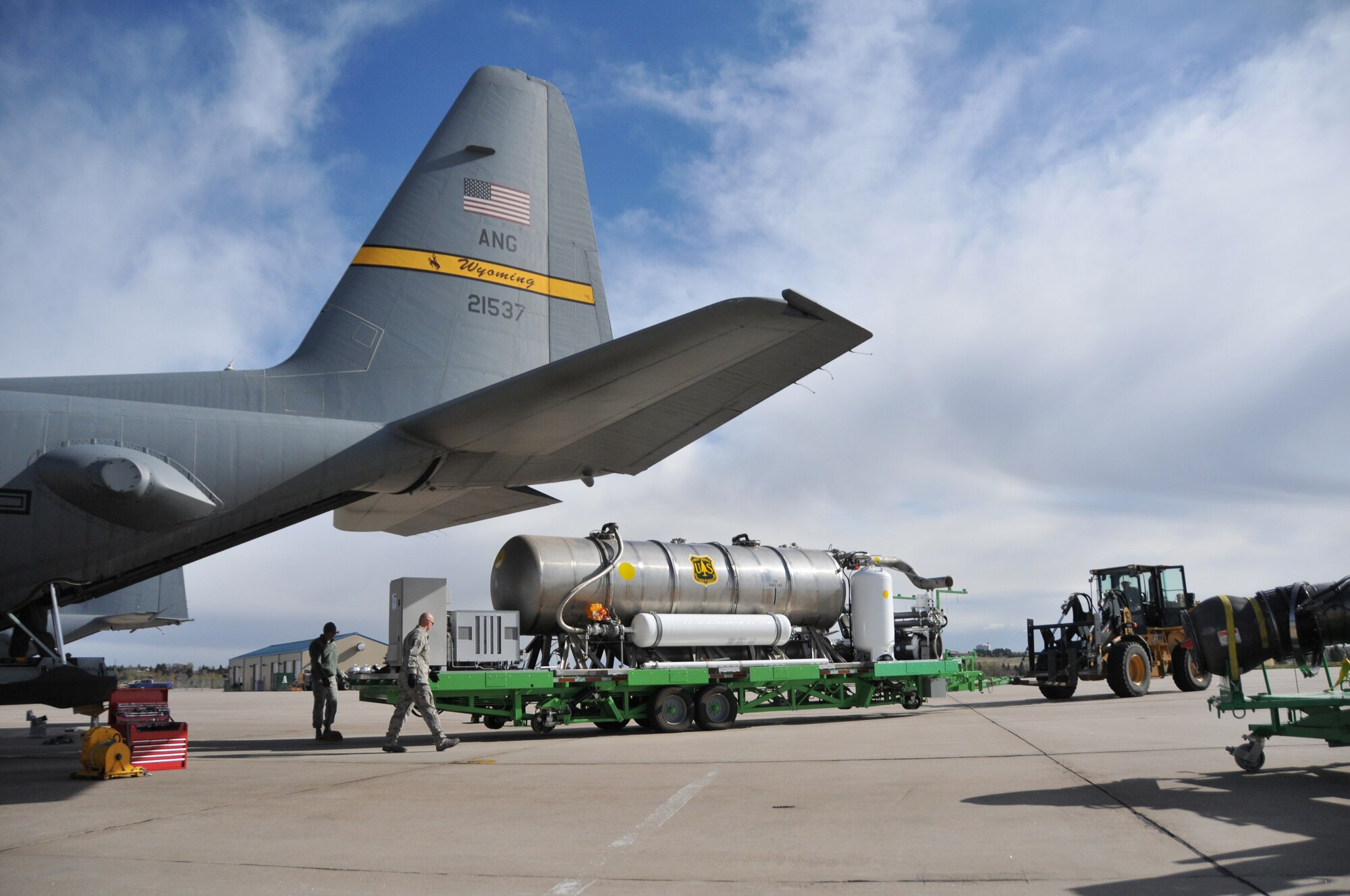 Airmen assigned to the 153rd Airlift Wing, Cheyenne, Wyo., prepare to load a U.S. Forest Service Modualar Airborne Firefighting System II onto a Wyoming Air National Guard C-130, April 13, 2012. The annual training maintains currency and upgrade qualifications for pilots, aircrew and ground crews in preparation for the fire season. (U.S. Air Force photo by 1st Lt. Rusty Ridley)