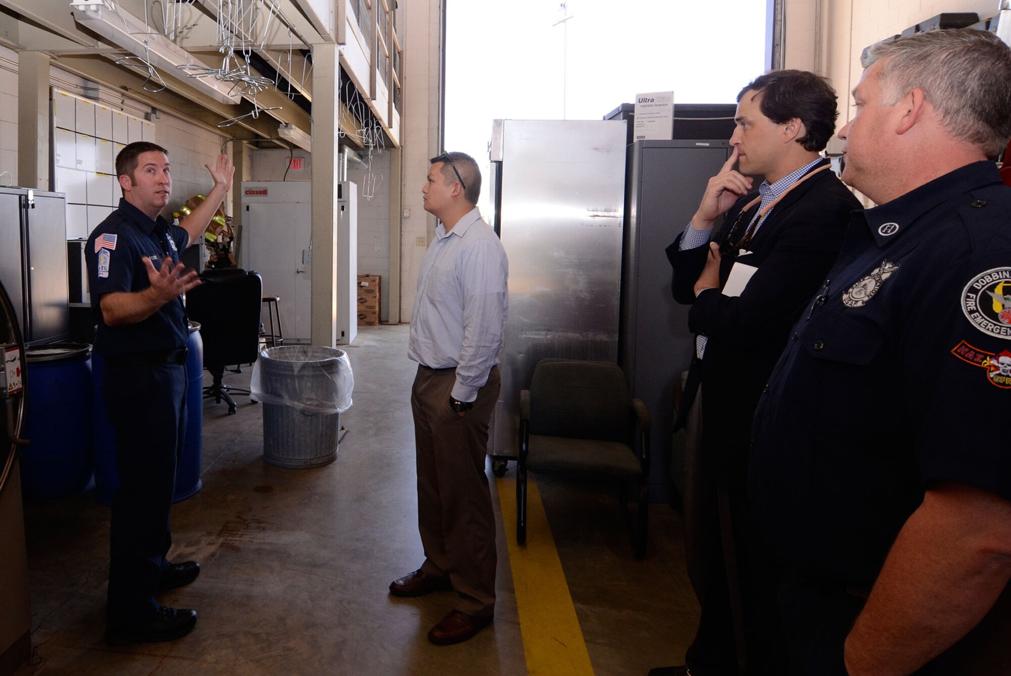 Patrick J. Cone, firefighter from the Dobbins Fire Department outlines some improvement concerns to Tommy Nguyen, staff member for Georgia Senator Johnny Isakson during his visit here April 9. (U.S. Air Force photo/Don Peek)
