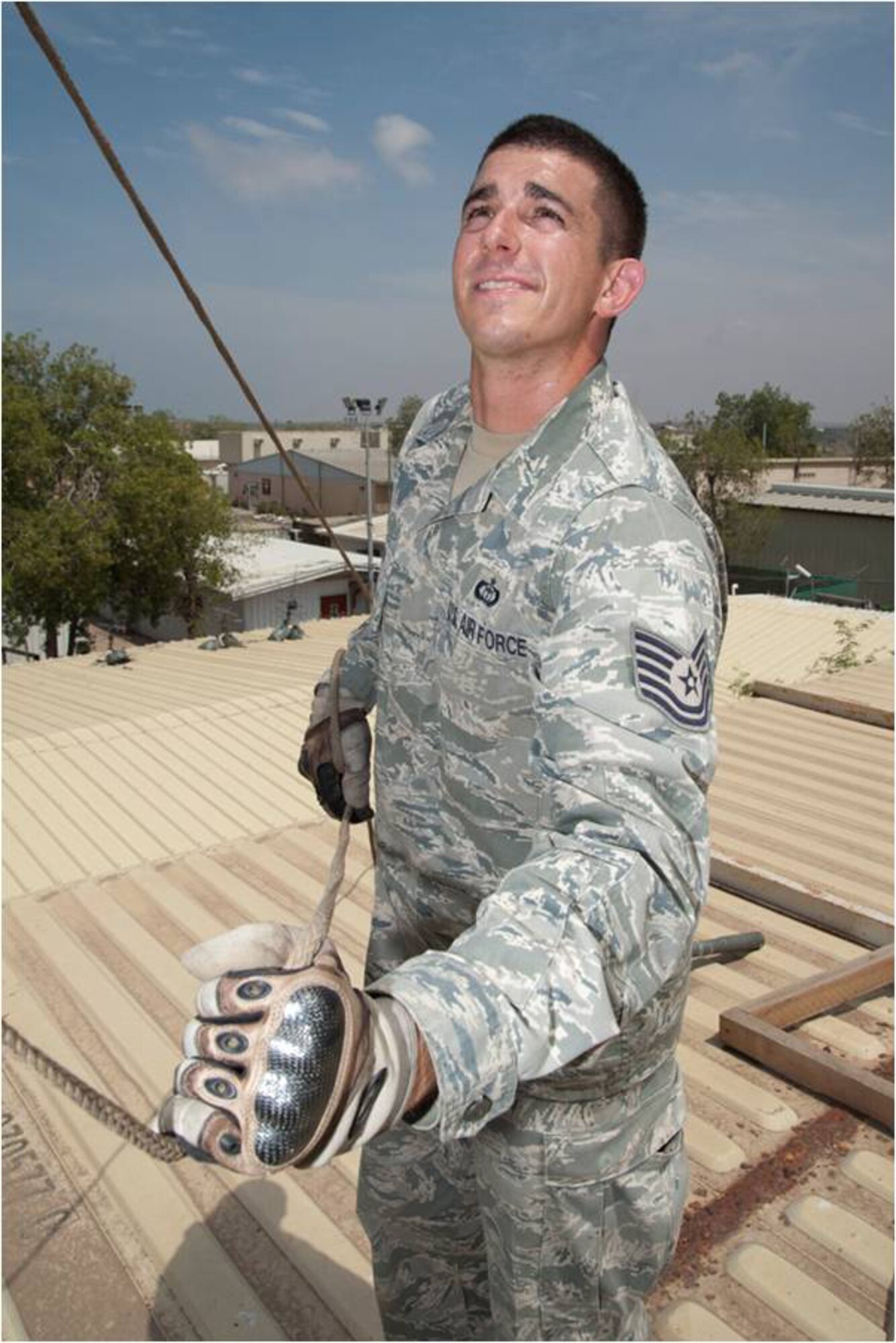 Tech. Sgt. Gregory Spiker, joint meteorology and oceanography operations weather forecaster, Combined Joint Task Force – Horn of Africa, uses a rope to lower the mast on radar used to detect rain and thunderstorms. Spiker was named the 2011 Air Force Weather Noncommissioned Officer of the Year. (U.S. Air Force photo by Tech. Sgt. Ryan Labadens)