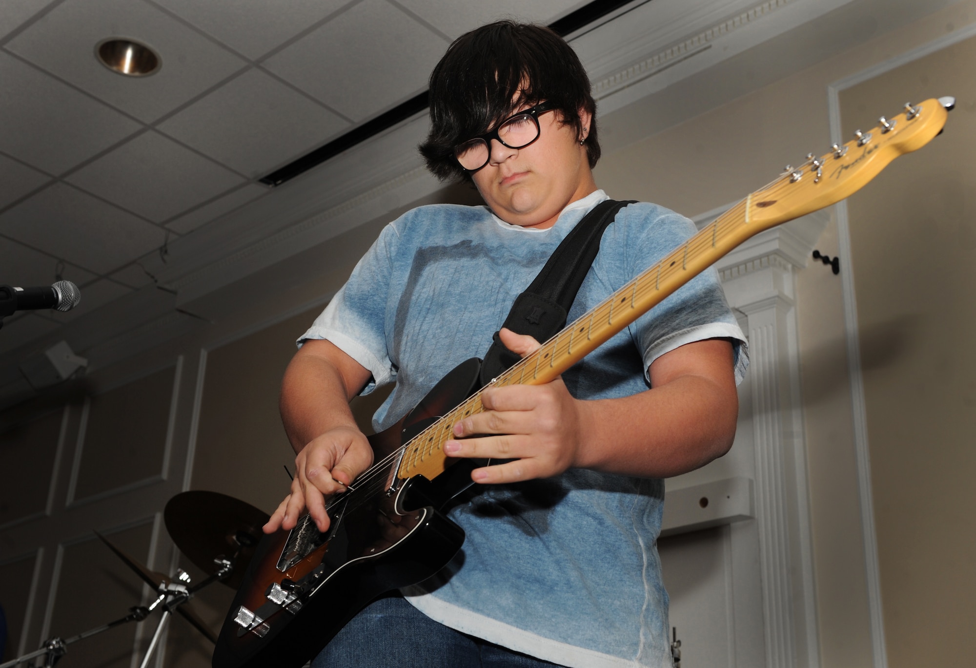 Ranen Murphy, lead singer and guitarist performs with his band during Shaw's Got Talent at the Carolina Skies Club, Shaw Air Force Base, S.C. April 11, 2012.Team Shaw members showcase various skills in the talent show competing for the trophy and top prize. (U.S. Air Force photo by Senior Airman Tabatha McCarthy/released)