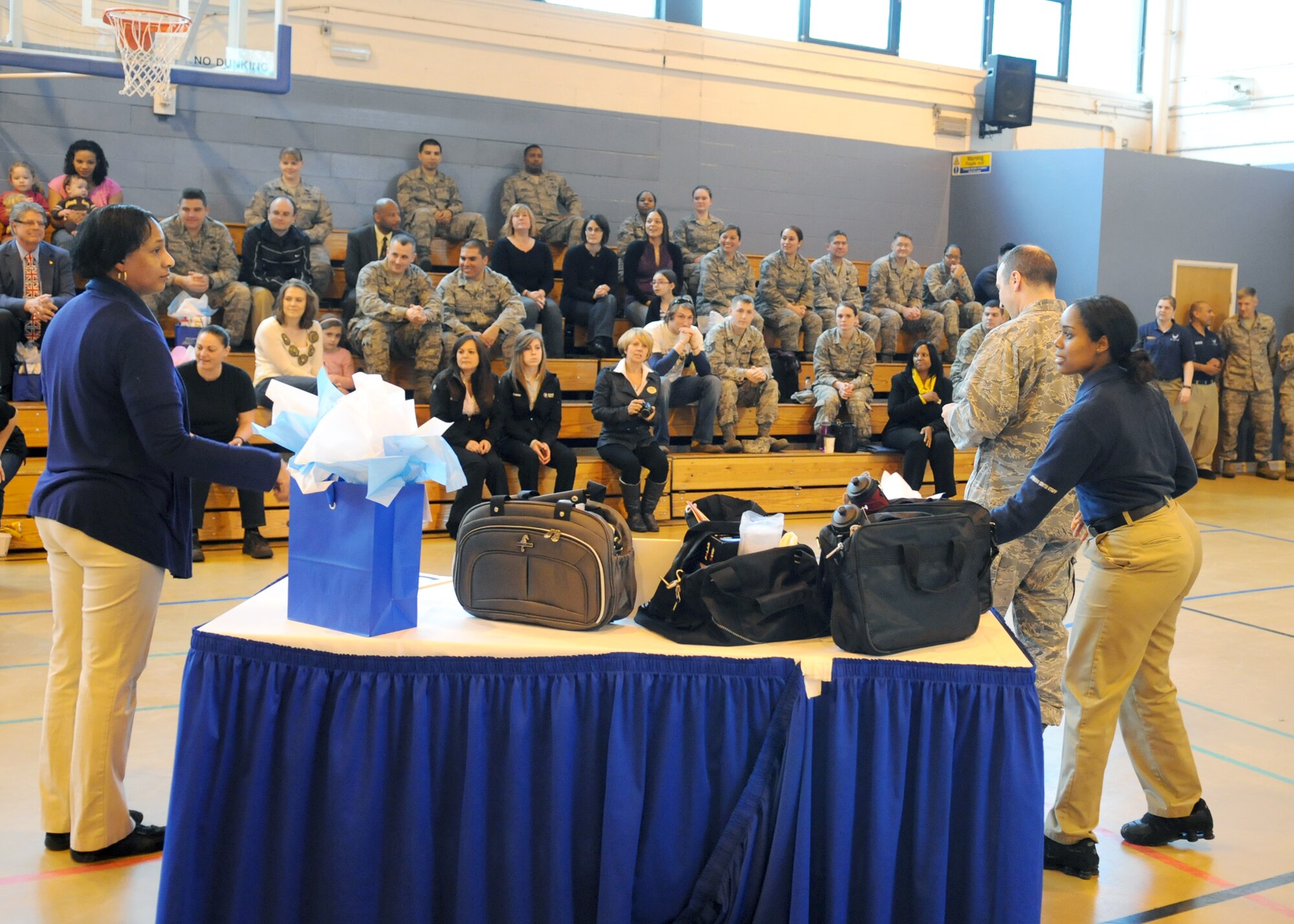 RAF MILDENHALL, England – Base members await the announcement of the winners of the RAF Mildenhall Biggest Loser Competition April 17, 2012, at the North Side Fitness Center.  In three months, 40 participants lost more than 170 inches from their waists and reduced body fat by almost 300 percent overall. (U.S. Air Force photo/Staff Sgt. Tabitha M. Lee)