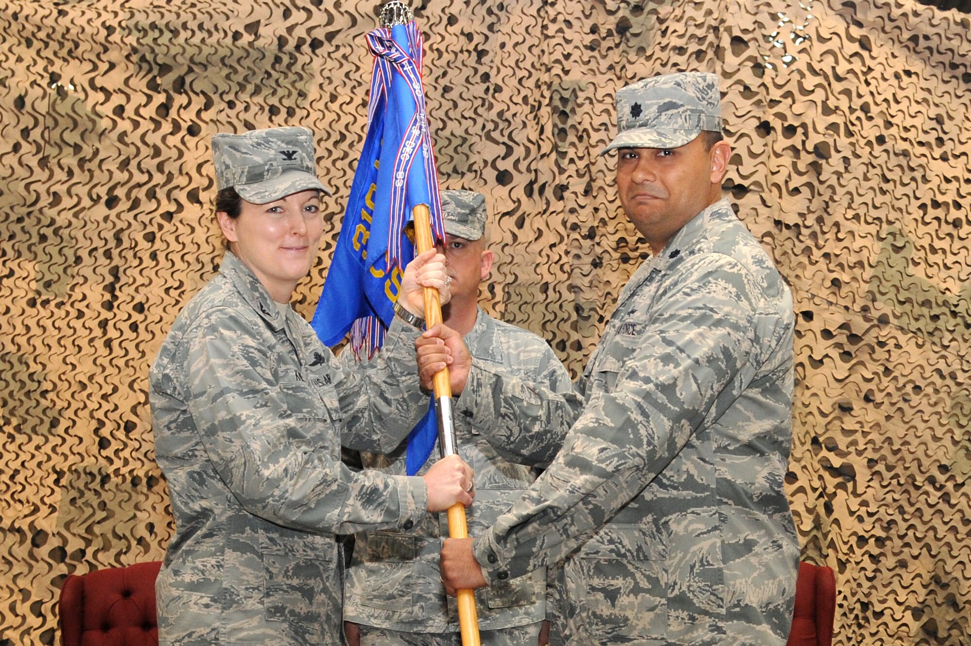 Lt. Col. Francisco R. Gonzalez, newly appointed commander of the 319th Communications Squadron, receives the guidon from Col. Tammy Knierim, commander of the 319th Mission Support Group, during the 319th CS Change of Command on Grand Forks Air Force Base April 13, 2012. Francisco replaced Lt. Col. Joe Moritz. (U.S. Air Force photo by Airman 1st Class Xavier Navarro)
