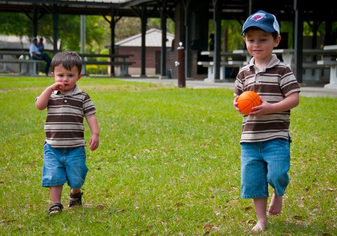 Three-year-old Hunter, son of Tricia and Staff Sgt. Justin Hoffman, 15th Airlift Squadron loadmaster, 437th Airlift Wing, heads to the basketball courts at a Joint Base Charleston – Air Base Park with his younger brother Cage not too far behind April 14. Hunter was recently diagnosed with moderate to severe classical autism and receives Applied Behavior Analysis therapy to help counteract the symptoms of the disease. He enjoys playing sports and especially hockey. (U.S. Air Force photo by Airman 1st Class Dennis Sloan/Released)