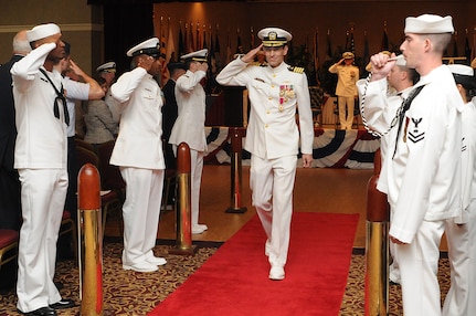 Captain Ralph Ward is rendered honors as he is piped ashore after his retirement ceremony held at the RedBank Club At Joint Base Charleston – Weapons Station April 13. Ward retired after 30 years of service. His last assignment was as Joint Base Charleston Deputy Commander  and Naval Support Activity Charleston commanding officer. (U.S. Navy photo/ Petty Officer 1st Class Jennifer Hudson)