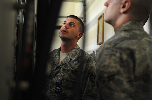 Pacific Air Forces Inspector General team member Tech. Sgt. Michael Wilson inspects equipment at the 8th Communications Squadron, April 18, 2012, on Kunsan Air Base, Republic of Korea. As part of the ongoing Consolidated Unit Inspection, CS Airmen were questioned and evaluated on their operation of radio frequency transmissions systems. (U.S. Air Force photo/Senior Airman Brigitte N. Brantley)