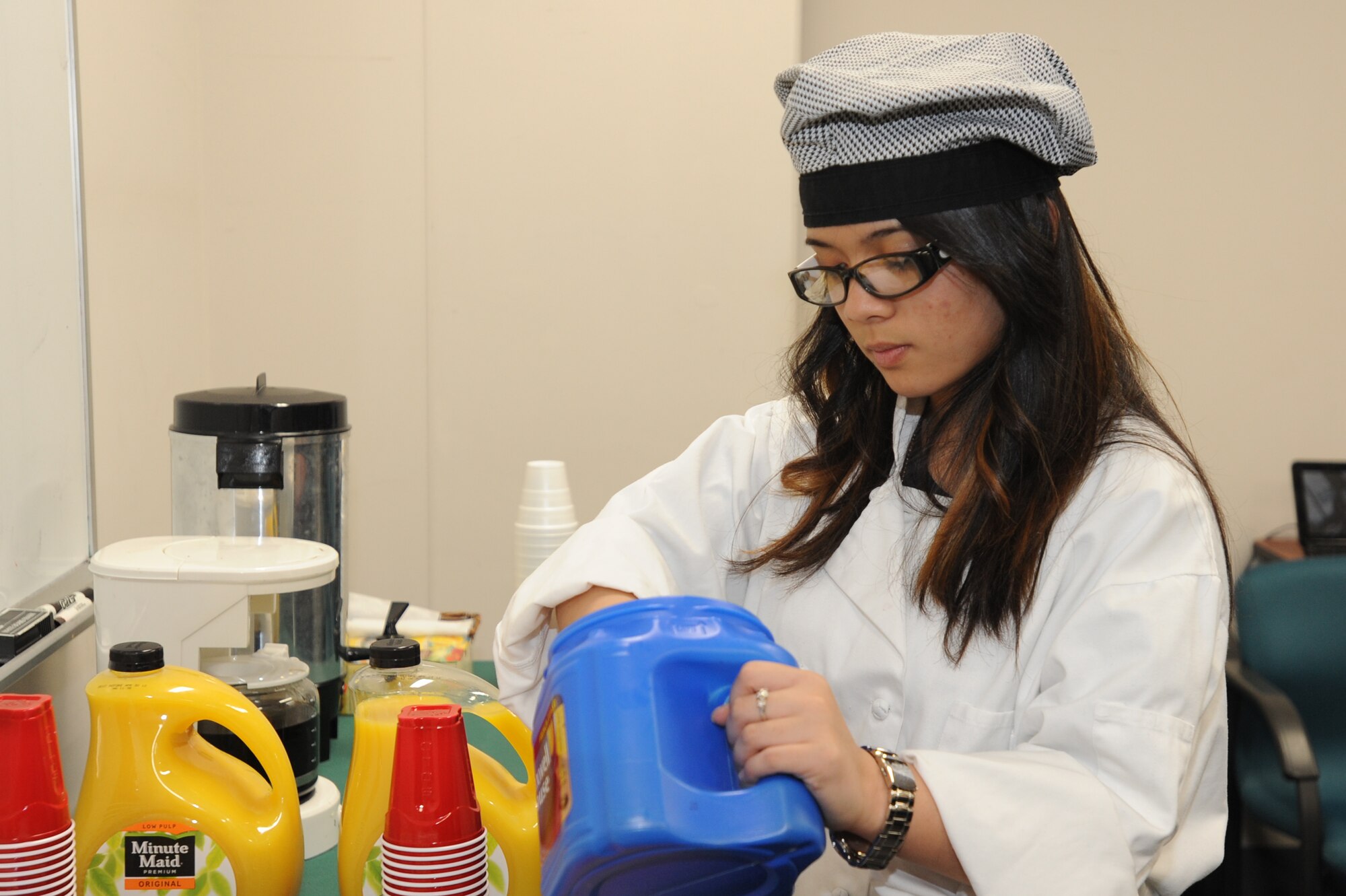 The daughter of U.S. Air Force Master Sgt. Michael David, 35th Aircraft Maintenance Squadron support section chief, prepares a fresh pot of coffee during the quarterly first sergeants' appreciation breakfast at Misawa Air Base, Japan, April 18, 2012. The breakfast was coordinated by the 35th Medical Group Mental Health Flight in recognition of the Month of the Military Child and Child Abuse Awareness. (U.S. Air Force photo by Airman Kenna Jackson/Released)
