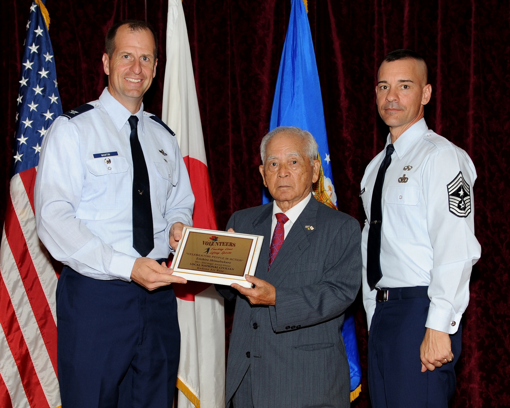Eiichiro Shimabukuro from the Airman and Family Readiness Center received the Angel Award in the civilian local national category during the 2012 Annual Volunteer Recognition Ceremony at the Rocker NCO Club April 17, 2012, at Kadena Air Base, Japan. Shimabukuro teaches and prepares weekly Sanshin classes at the AFRC. He also serves as a liaison between Okinawans and Americans with his extensive knowledge and skills. Shimabukuro has been teaching Sanshin evening classes at the AFRC since 2008. (U.S. Air Force photo by Junko Kinjo/Released)