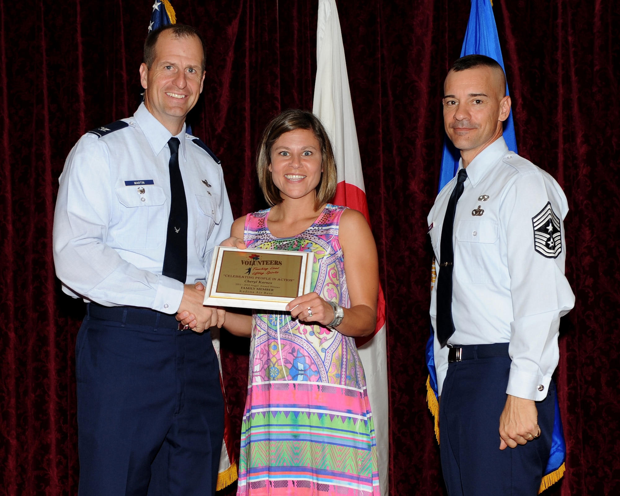 Cheryl Karnes from the Kadena Chapel received the Angel Award in the family member category during the 2012 Annual Volunteer Recognition Ceremony at the Rocker NCO Club April 17, 2012, at Kadena Air Base, Japan. Karnes has volunteered more than 700 hours, and saved the Air Force more than $31,000 through volunteering. She volunteers to cook, train, recruit and encourage others. She was also responsible for planning, organizing, advertising and hosting over 28 events for the Protestant Parish. (U.S. Air Force photo by Junko Kinjo/Released)

