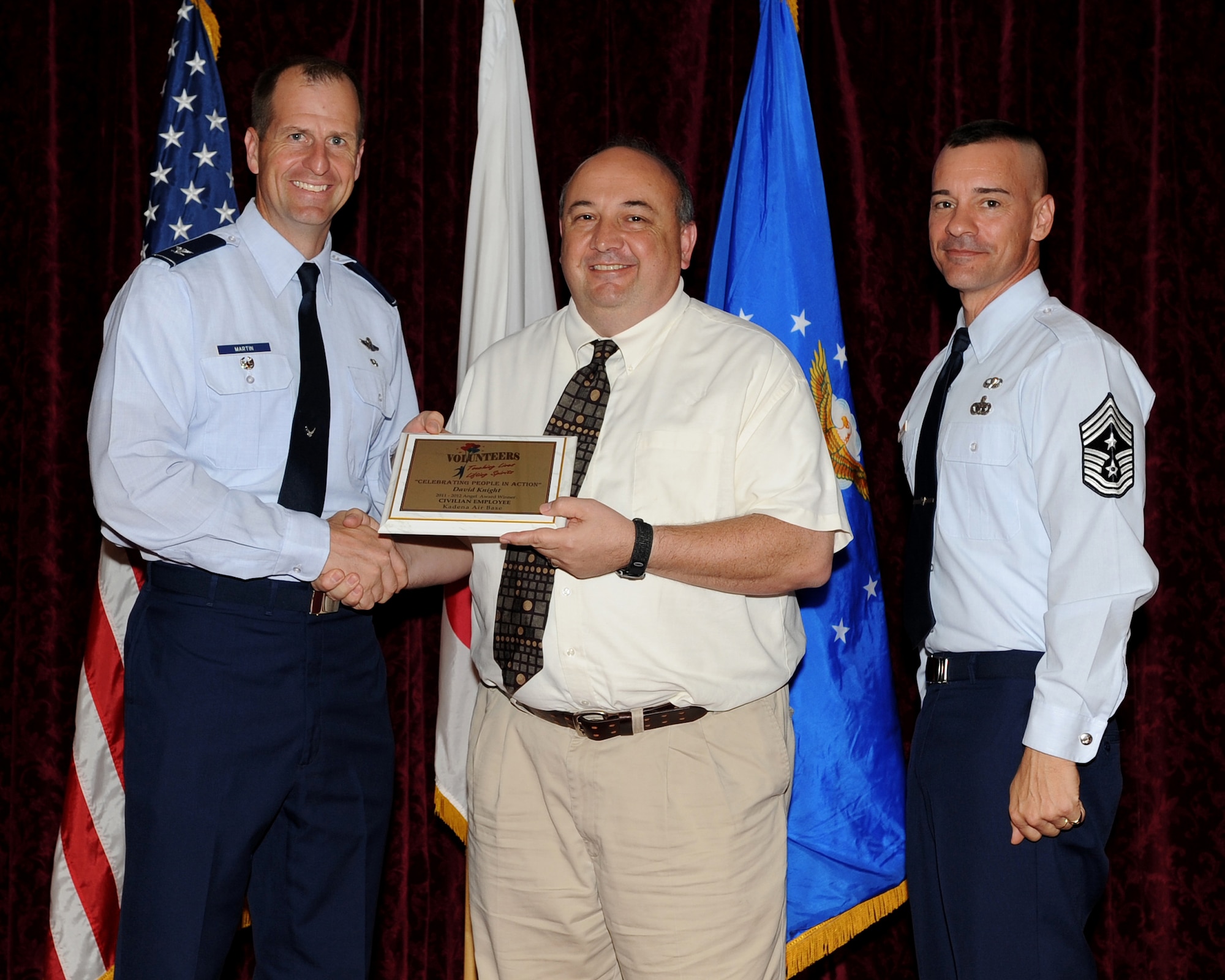 David Knight from Kadena Elementary School received the Angel Award Winner in the civilian employee category during the 2012 Annual Volunteer Recognition Ceremony at the Rocker NCO Club April 17, 2012, at Kadena Air Base, Japan. Knight has volunteered more than 600 hours as the director of Kadena’s Wired Bean working with 5,400 dorm residents. He also led airmen in various service projects including landscaping at a local school and supporting chapel marriage and family events. He has volunteered at least five hours every day since the September 2011 opening of the facility for unaccompanied Airmen and ensuring that they had an alcohol-free alternative. (U.S. Air Force photo by Junko Kinjo/Released)