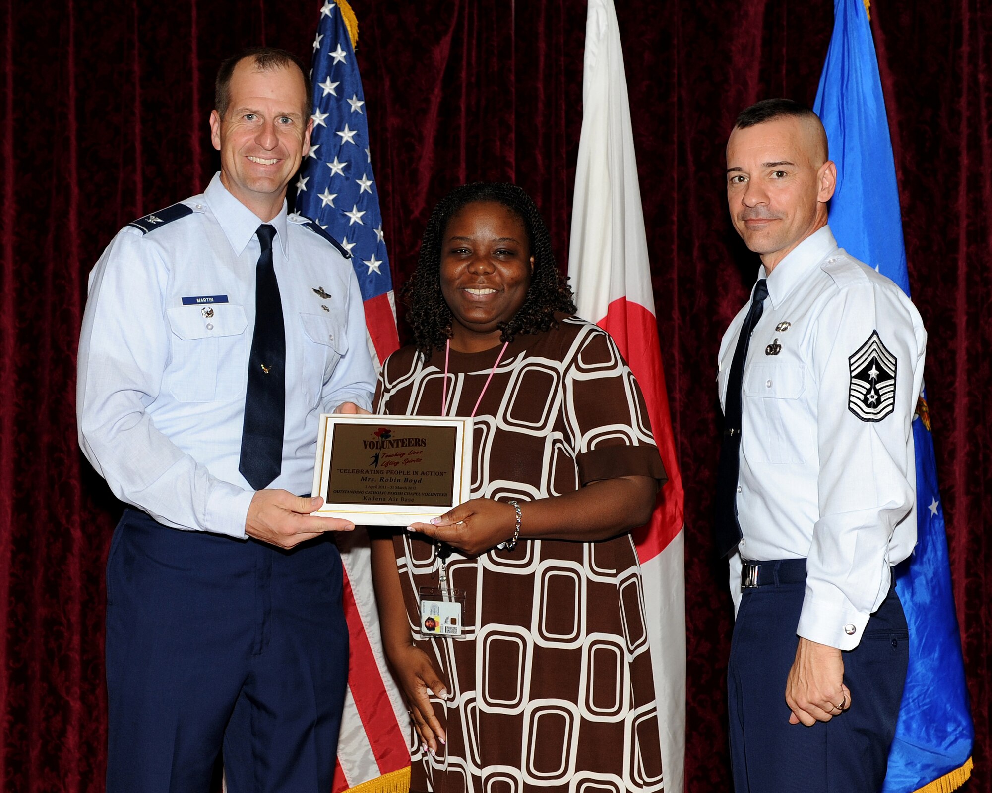 Robin Boyd, 18th Contracting Squadron, was named the Kadena Chapel Catholic Parish Outstanding Volunteer of the Year during the 2012 Annual Volunteer Recognition Ceremony at the Rocker NCO Club April 17, 2012, at Kadena Air Base, Japan. Boyd volunteered more than 1,000 hours to better the community. Thirty-six volunteers were recognized for their contributions to the base and local community.  (U.S. Air Force photo by Junko Kinjo/Released)
