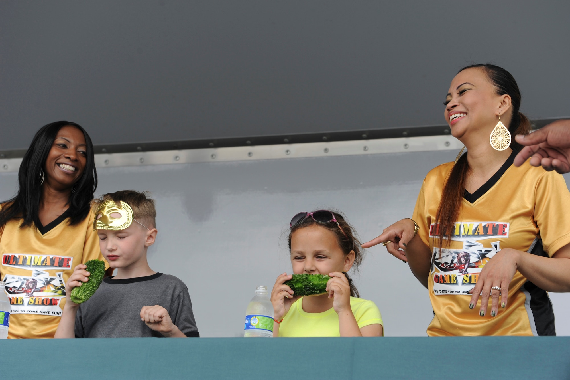 Contestants from the Ultimate Game Show "Green Edition" eat Goya during the second annual EarthFest on Kadena Air Base, Japan, April 14, 2012. EarthFest is a community collaborative event, celebrating all the things that the month of April has to offer.(U.S. Air Force photo by Airman 1st Class Justin Veazie/released)