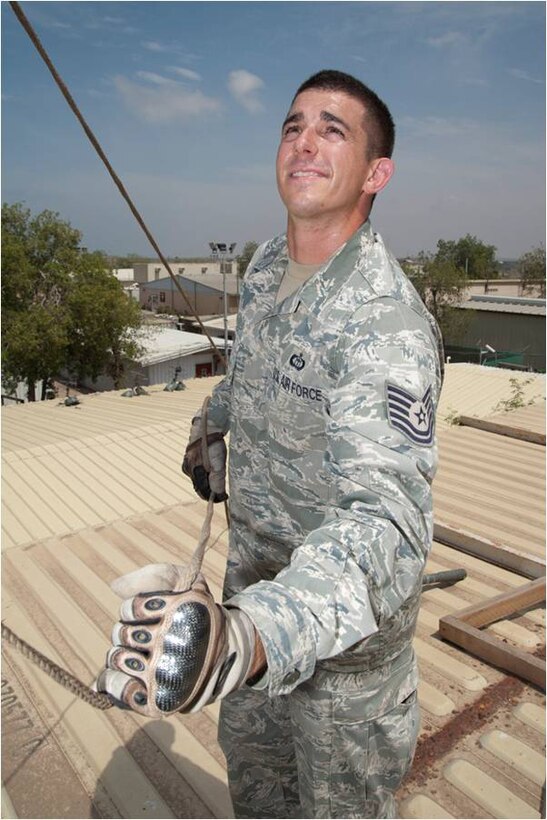 Air Force Tech. Sgt. Gregory Spiker, joint meteorology and oceanography operations weather forecaster, Combined Joint Task Force – Horn of Africa, uses a rope to lower the mast on a radar unit used to detect rain and thunderstorms Camp Lemonnier, Djibouti. Spiker was named the 2011 Air Force Weather Noncommissioned Officer of the Year. U.S. Air Force photo by Tech. Sgt. Ryan Labadens