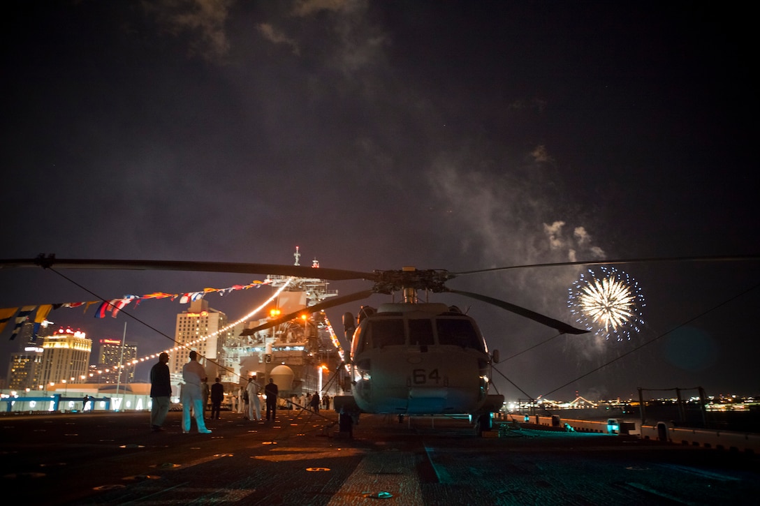 Navy MH-60S sits on the USS Wasp docked on the Mississippi riverfront during a fireworks presentation here, April 18, 2012. The fireworks presentation was part of the reception held in honor of the War of 1812 Commemoration. New Orleans will serve as the inaugural city in a three-year national celebration commemorating the War of 1812 and the Star-Spangled Banner. The Marine Corps' role in this event reinforces its naval character, showcases the Navy-Marine Corps team and highlights the military's enduring relationship with the city of New Orleans. (U.S. Marine Corps photo by Lance Cpl. Marcin Platek/Released