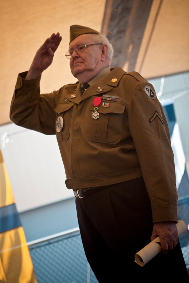 Leon C. Standifer, a World War II veteran, salute during the national anthem played after he received the Legion of Honor medal, France’s highest reward for valor, during a French navy reception aboard Germinal, April 18, 2012. The reception was held in honor of the War of 1812 Commemoration. New Orleans will serve as the inaugural city in a three-year national celebration commemorating the War of 1812 and the Star-Spangled Banner. The Marine Corps' role in this event reinforces its naval character, showcases the Navy-Marine Corps team and highlights the military's enduring relationship with the city of New Orleans. (U.S. Marine Corps photo by Lance Cpl. Marcin Platek/Released)