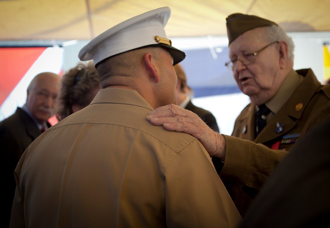 Leon C. Standifer, a World War II veteran who received the Legion of Honor medal, France’s highest reward for valor, talks with Col. Gregg T. Habel, Marine Forces Reserve chief of staff, during a French navy reception aboard Germinal, April 18, 2012. The reception was held in honor of the War of 1812 Commemoration. New Orleans will serve as the inaugural city in a three-year national celebration commemorating the War of 1812 and the Star-Spangled Banner. The Marine Corps' role in this event reinforces its naval character, showcases the Navy-Marine Corps team and highlights the military's enduring relationship with the city of New Orleans. (U.S. Marine Corps photo by Lance Cpl. Marcin Platek/Released)