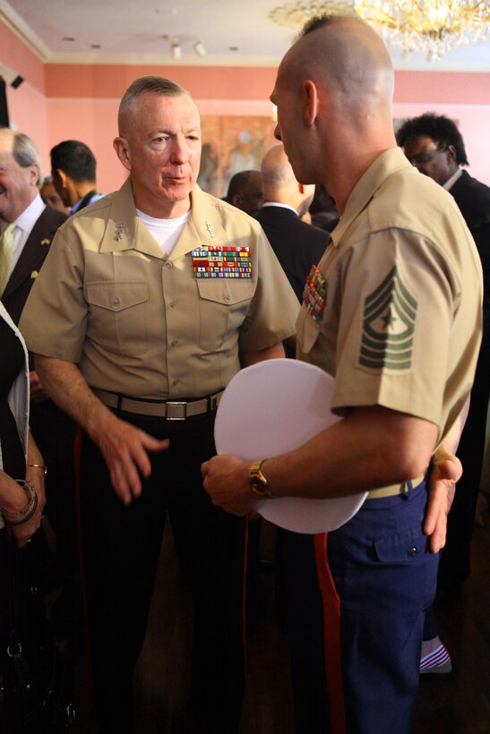 Lt. Gen. Steven A. Hummer, commander of Marine Forces Reserve and Marine Forces North , greets  Sgt. Maj. Todd M. Parisi, sergeant major of the 26th Marine Expeditionary Unit, at Gallier Hall here, April 18, 2012, during the mayoral welcome of the Navy and foreign ships in New Orleans. New Orleans will serve as the inaugural city in a three-year national celebration commemorating the War of 1812 and the Star-Spangled Banner. The Marine Corps' role in this event reinforces its naval character, showcases the Navy-Marine Corps team and highlights the military's enduring relationship with the city of New Orleans.(U.S. Marine Corps photo by Lance Cpl. Marcin Platek/Released)