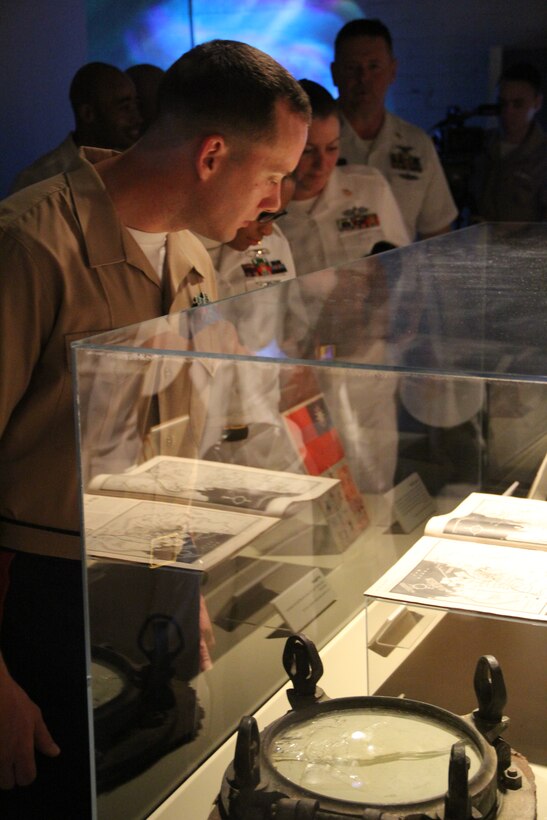 Gunnery Sgt. Michael Kropiewnicki, 26th Marine Expeditionary Unit combat camera chief, explores "The Turning Point" exhibit at the National World War II Museum in New Orleans April 19, 2012. The 26th MEU is currently providing support to the Commemoration of the Battle of New Orleans. Starting this April and continuing through 2015, the U.S. Navy, U.S. Marine Corps and U.S. Coast Guard will commemorate the Bicentennial of the War of 1812 and the Star Spangled Banner.  The War of 1812 celebration will commemorate the rich Naval history and showcase the capabilities of today's Navy-Marine Corps team. (Official Marine Corps photo by Staff Sgt. Edward R. Guevara Jr./26th Marine Expeditionary Unit)