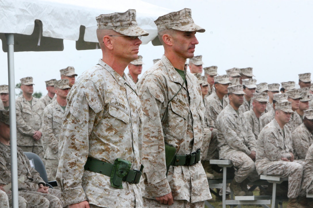 Lt. Col. Gregory T. Puntney, left, the outgoing commanding officer of Marine Wing Communication Squadron 28, 2nd Marine Aircraft Wing, and Lt. Col. Matthew E. Limbert, the incoming commanding officer, await the arrival of the unit colors during a change of command ceremony aboard Marine Corps Air Station Cherry Point, N.C., April 19, 2012. During the ceremony, Puntney humbly reflected on his tenure as the "Spartans" commander. "It is a singular honor and privilege to be here, on this day, on this field, with these Marines. We celebrate this team and their achievements," he said. "Matt, I look forward to observing from afar how you will lead the Marines and take them to the next level. They are poised and ready."