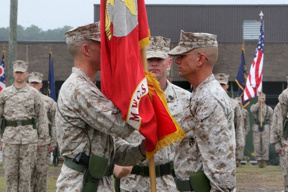 Lt. Col. Matthew E. Limbert, takes the unit colors and responsibilities as commanding officer of Marine Wing Communications Squadron 28 from Lt. Col. Gregory T. Puntney, during a change of command ceremony aboard Marine Corps Air Station Cherry Point, N.C., April 19, 2012. "To the Marines, thank you for everything you have done and you will do. I look forward to the every day," Limbert said during the ceremony.