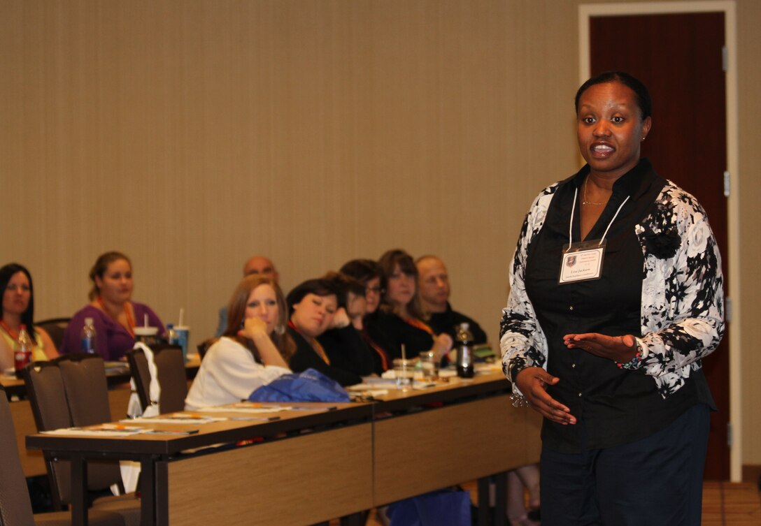 Lisa Jackson, Family Readiness coordinator for the 8th Marine Corps District, explains the programs and resources available to Marine spouse on recruiting duty, during the District Spouse Orientation Course held April 18-20 in Arlington, Texas.  Jackson, along with 13 other presenters, provided 44 Marine spouses with information and resources to help ease the challenges of being a spouse of a Marine on recruiting duty.