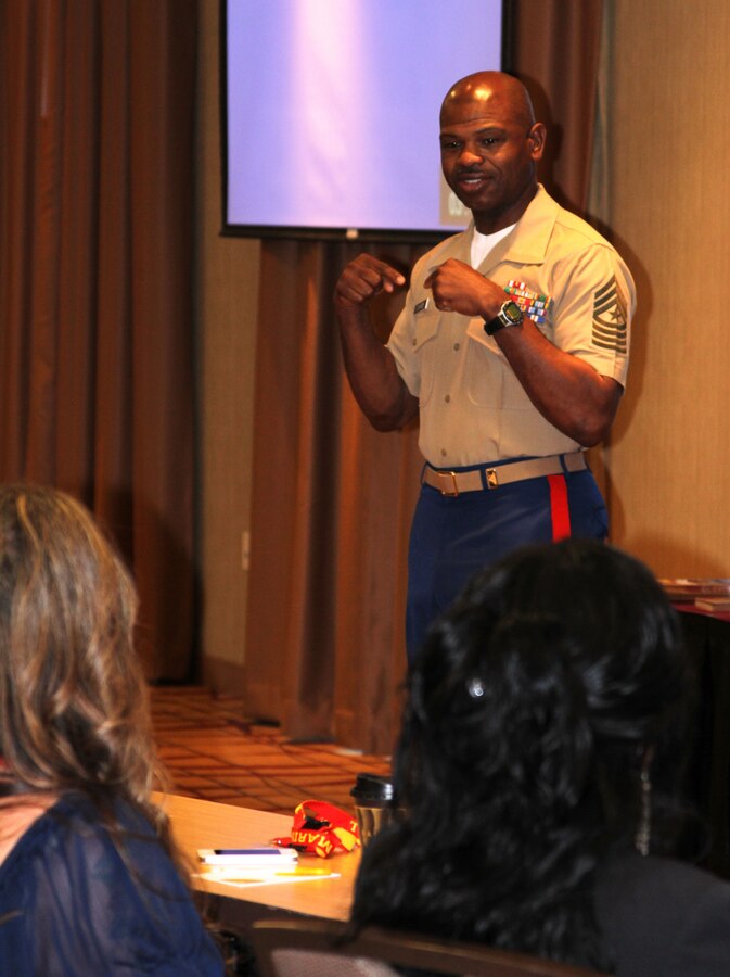 Sgt. Maj. JB Edwards, sergeant major, 8th Marine Corps District, explains the correlation between stress at home and stress at work to Marine spouses during the District Spouse Orientation Course held April 18-20 in Arlington, Texas.  The course provided critical information for spouses of Marine recruiters to help them overcome the stress and long hours associated with recruiting duty.