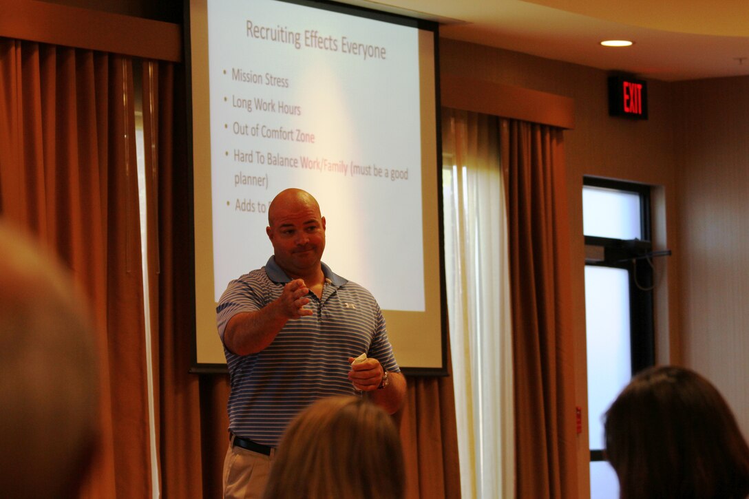 Master Gunnery Sgt. Charles Harper, contact team chief, 8th Marine Corps District, speaks to Marine spouses during the District Spouse Orientation Course held in Arlington, Texas, April 18-20.  The course provided critical information for spouses of Marine recruiters to help them overcome the stress and long hours associated with recruiting duty.