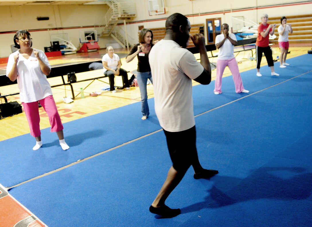 ANDERSEN AIR FORCE BASE Guam- Tech. Sgt. Anthony Johnson, 736th Security Forces Squadron, demonstrates a combative technique during a Sexual Assault Awareness Month self defense class April 17. The class is one of several SAAM events happening during the month of April on Andersen. (U.S. Air Force photo by Senior Airman Jeffrey Schultze)  