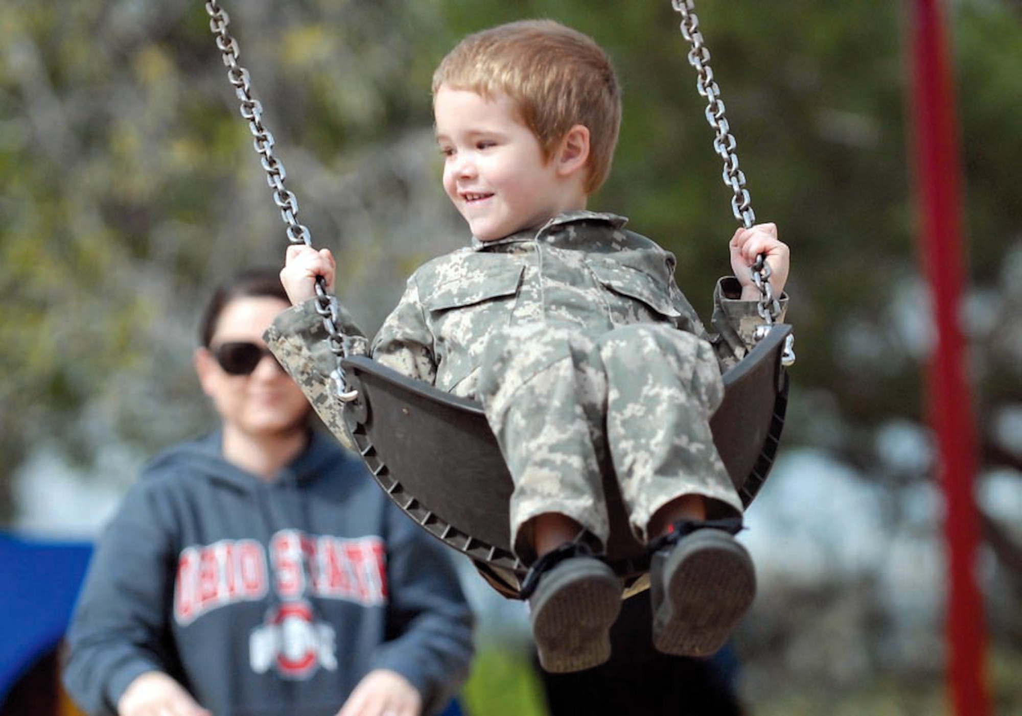 Spc. Nicole Webb pushes her son Jase on a swing at California Oaks Sports Park, near March Air Reserve Base. Webb; is raising her son; taking classes to become a registered nurse; and fulfilling her Army Reserve duties. (U.S. Army photo by Sgt. Tracy Ellingsen)
