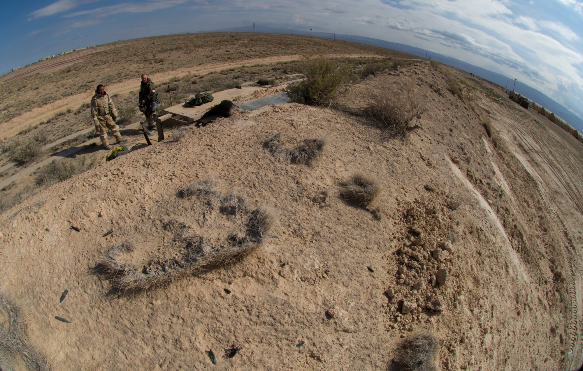HOLLOMAN AIR FORCE BASE, N.M. – Airmen from the 49th Civil Engineer and Materiel Maintenance Squadrons build a defensive fighting position during a Bivouac exercise April 11. A DFP is part of a network of strategically placed defensive points on the perimeter of a base that provide ground protection from hostile threats. (U.S. Photo by Airman 1st Class Michael Shoemaker/Released)