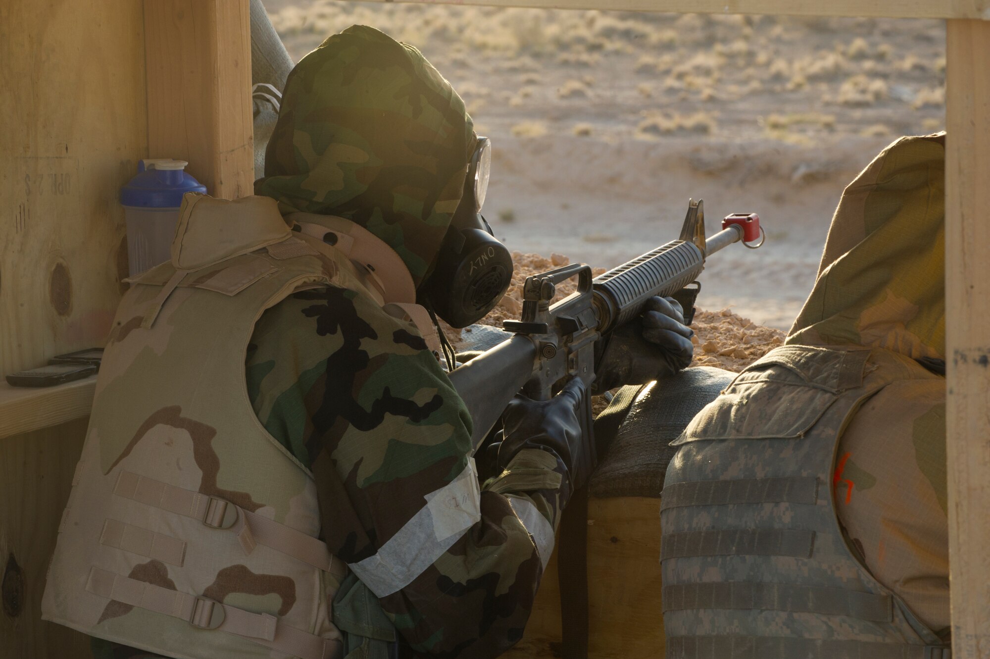 HOLLOMAN AIR FORCE BASE, N.M. – Airmen from the 49th Civil Engineer and Materiel Maintenance Squadrons assume their positions at a defensive fighting position during a Bivouac exercise April 11. A DFP is part of a network of strategically placed defensive points on the perimeter of a base that provide ground protection from hostile threats. (U.S. Photo by Airman 1st Class Michael Shoemaker/Released)